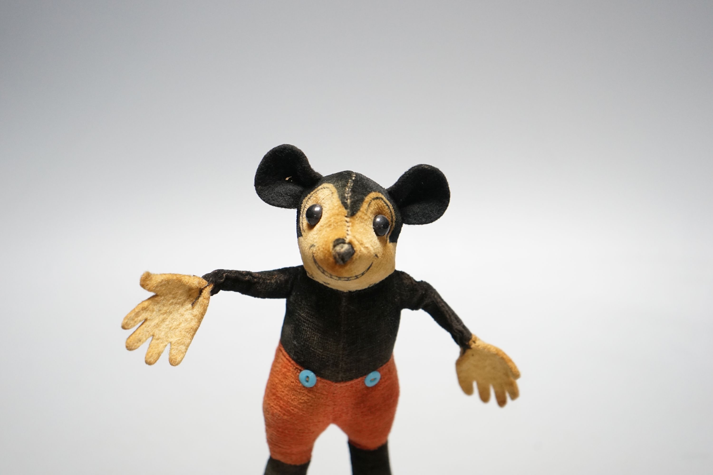 A 1930's Dean’s Ragbook felt and velvet model of Micky Mouse, 7 cms high.